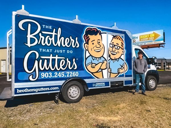 The Brothers That Just Do Gutters franchise truck with professional branding and gutter installation equipment
