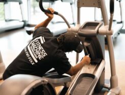 Fitness Machine Technicians Franchise owner working on fitness machine