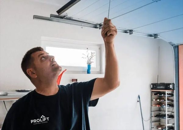 ProLift Garage Doors Franchise Service Rep installing garage door