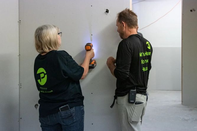 PatchMaster Franchise team nailing down drywall. 