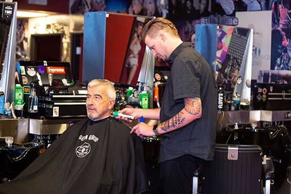 Floyd's 99 Barbershop Client getting a haircut and massage