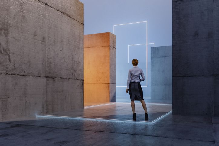Lost businesswoman standing in concrete maze depicting uncertainty.