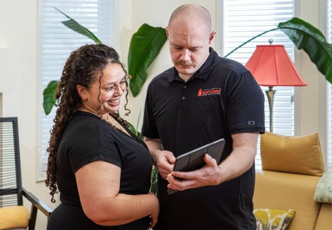 A Buyer's Choice Franhcise Home Inspector and Client