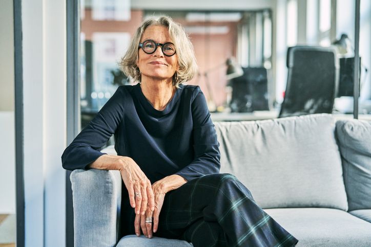 Senior Business woman showing her successful stature