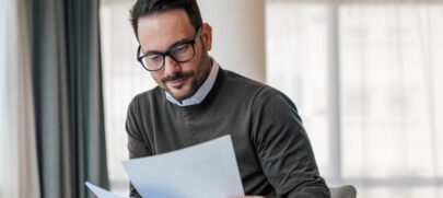 A Business professional reviewing franchise documents